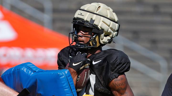 Purdue Boilermakers wide receiver Tra'Mar Harris (11) runs a drill. Purdue Boilermakers wide receiver Tra'Mar Harris (11) runs a drill.
