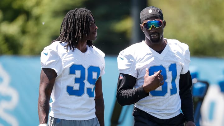 Detroit Lions cornerback Morice Norris (39) talks to safety Kerby Joseph (31)