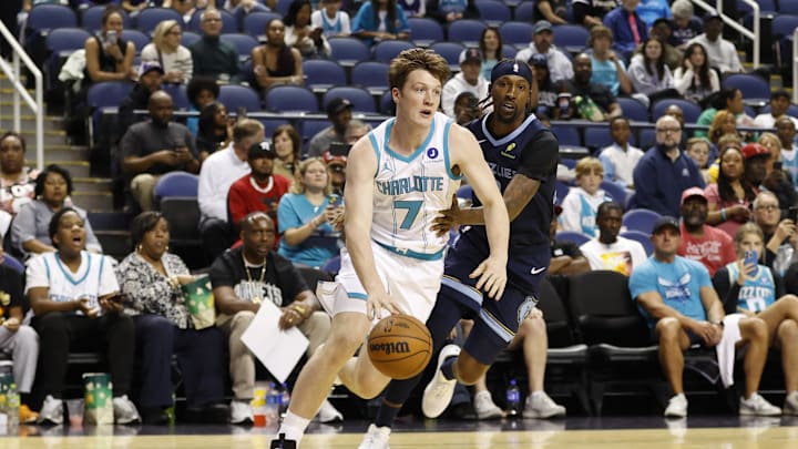 Oct 15, 2025; Greensboro, North Carolina, USA; Charlotte Hornets guard/forward Kon Knueppel (7) drives past Memphis Grizzlies guard Kentavious Caldwell-Pope (3) during first quarter action at First Horizon Coliseum. Mandatory Credit: Brian Westerholt-Imagn Images Oct 15, 2025; Greensboro, North Carolina, USA; Charlotte Hornets guard/forward Kon Knueppel (7) drives past Memphis Grizzlies guard Kentavious Caldwell-Pope (3) during first quarter action at First Horizon Coliseum. Mandatory Credit: Brian Westerholt-Imagn Images