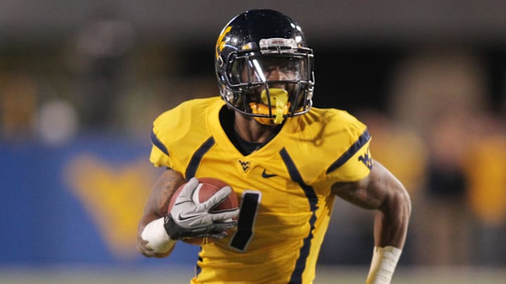 November 17, 2012; Morgantown, WV, USA; West Virginia Mountaineers wide receiver Tavon Austin (1) carries the ball on a 31 yard gain against the Oklahoma Sooners during the first quarter at Milan Puskar Stadium . Mandatory Credit: Charles LeClaire-Imagn Images