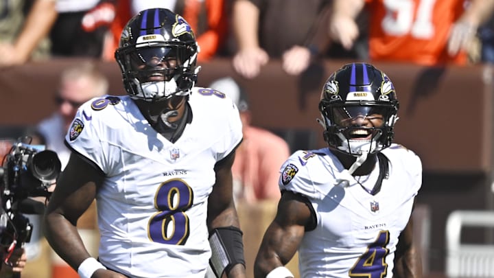 Baltimore Ravens quarterback Lamar Jackson celebrates his rushing touchdown with wide receiver Zay Flowers.