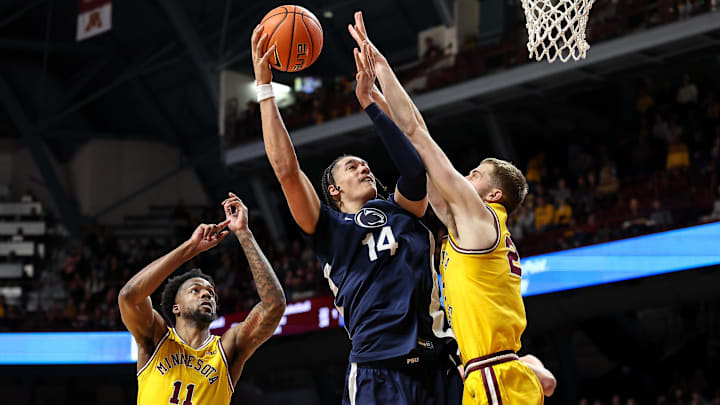 Penn State Nittany Lions forward Yanic Konan Niederhauser shoots as Minnesota Golden Gophers forward Parker Fox defends during the second half of a Big Ten game. 
