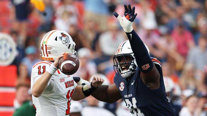 Nov 22, 2025; Auburn, Alabama, USA; Auburn Tigers defensive lineman Zykeivous Walker (91) closes in on Mercer Bears quarterback Braden Atkinson (11) during the third quarter at Jordan-Hare Stadium. Mandatory Credit: John Reed-Imagn Images Nov 22, 2025; Auburn, Alabama, USA; Auburn Tigers defensive lineman Zykeivous Walker (91) closes in on Mercer Bears quarterback Braden Atkinson (11) during the third quarter at Jordan-Hare Stadium. Mandatory Credit: John Reed-Imagn Images