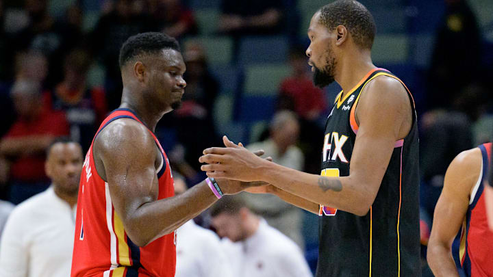 Apr 1, 2024; New Orleans, Louisiana, USA; New Orleans Pelicans forward Zion Williamson, left, congratulates Phoenix Suns forward Kevin Durant, right, after the Suns defeated the Pelicans at Smoothie King Center. Mandatory Credit: Matthew Hinton-Imagn Images