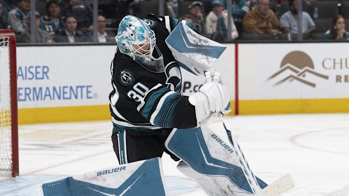 Mar 3, 2026; San Jose, California, USA;  San Jose Sharks goaltender Yaroslav Askarov (30) passes the puck during the third period against the Montreal Canadiens at SAP Center at San Jose. Mandatory Credit: Stan Szeto-Imagn Images