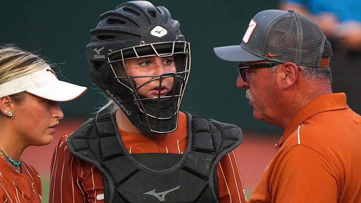 Texas Longhorns catcher Reese Atwood (14) listens to head coach Mike White during the game against Baylor at Red & Charline McCombs Field on Friday, May 5, 2023 in Austin.
