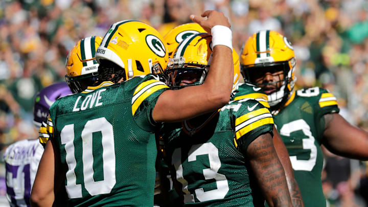 Green Bay Packers quarterback Jordan Love (10) and Dontayvion Wicks.