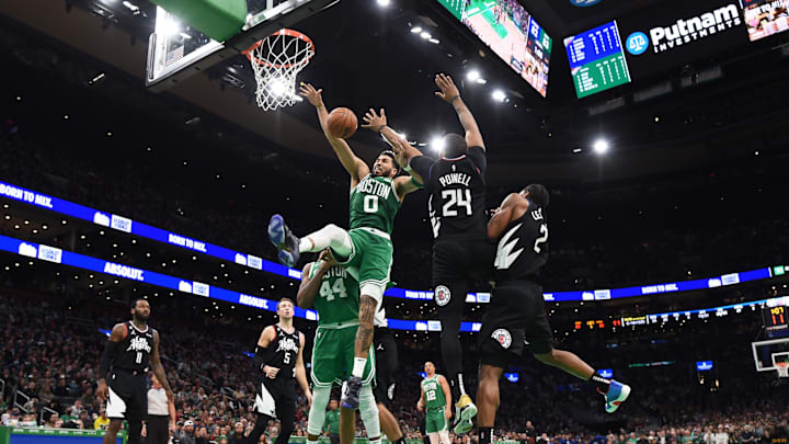Dec 29, 2022; Boston, Massachusetts, USA; Boston Celtics forward Jayson Tatum (0) is fouled by LA Clippers forward Norman Powell (24) during the second half at TD Garden. Mandatory Credit: Bob DeChiara-Imagn Images Dec 29, 2022; Boston, Massachusetts, USA; Boston Celtics forward Jayson Tatum (0) is fouled by LA Clippers forward Norman Powell (24) during the second half at TD Garden. Mandatory Credit: Bob DeChiara-Imagn Images