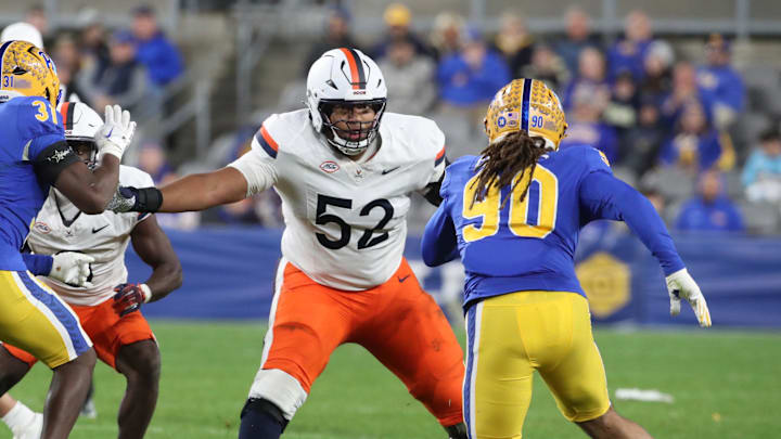 Nov 9, 2024; Pittsburgh, Pennsylvania, USA;  Virginia Cavaliers offensive lineman McKale Boley (52) blocks at the line of scrimmage against the Pittsburgh Panthers during the third quarter at Acrisure Stadium. Mandatory Credit: Charles LeClaire-Imagn Images