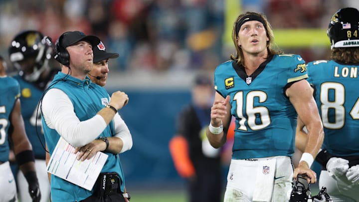 Oct 6, 2025; Jacksonville, Florida, USA; Jacksonville Jaguars head coach Liam Coen and quarterback Trevor Lawrence (16) during the first half against the Kansas City Chiefs at EverBank Stadium. Mandatory Credit: Morgan Tencza-Imagn Images