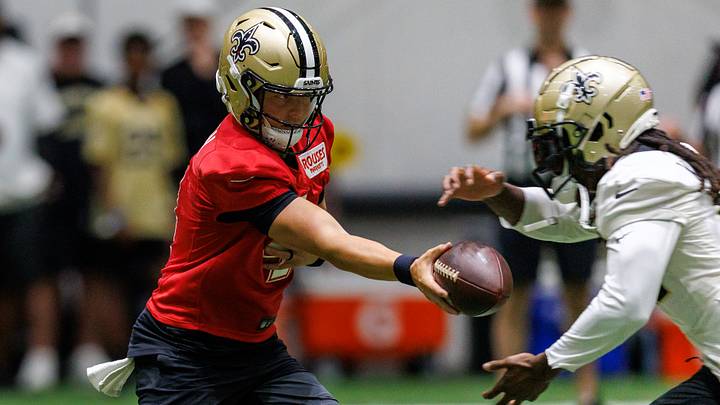 Aug 02, 2026; Metairie, LA, USA; New Orleans Saints quarterback Zach Wilson (4) hands off to running back Alvin Kamara (41) during training camp at Ochsner Sports Performance Center. Mandatory Credit: Stephen Lew-Imagn Images Aug 02, 2026; Metairie, LA, USA; New Orleans Saints quarterback Zach Wilson (4) hands off to running back Alvin Kamara (41) during training camp at Ochsner Sports Performance Center. Mandatory Credit: Stephen Lew-Imagn Images