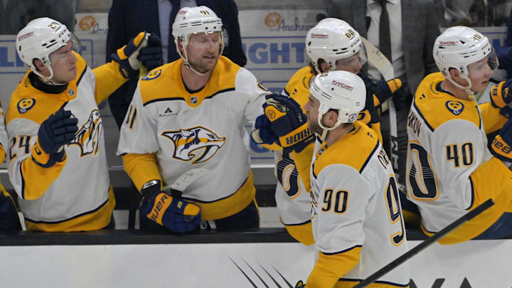 Jan 25, 2025; Anaheim, California, USA; Nashville Predators center Ryan O'Reilly (90) is congratulated at the bench after scoring a goal in the second period against the Anaheim Ducks at Honda Center. Mandatory Credit: Jayne Kamin-Oncea-Imagn Images