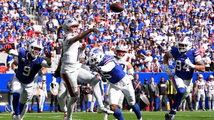 Oct 4, 2026; Orchard Park, New York, USA; New England Patriots quarterback Drake Maye (10) throws a pass while under pressure from Buffalo Bills linebacker Greg Rousseau (15) during the third quarter at New Highmark Stadium. Mandatory Credit: Gregory Fisher-Imagn Images Oct 4, 2026; Orchard Park, New York, USA; New England Patriots quarterback Drake Maye (10) throws a pass while under pressure from Buffalo Bills linebacker Greg Rousseau (15) during the third quarter at New Highmark Stadium. Mandatory Credit: Gregory Fisher-Imagn Images