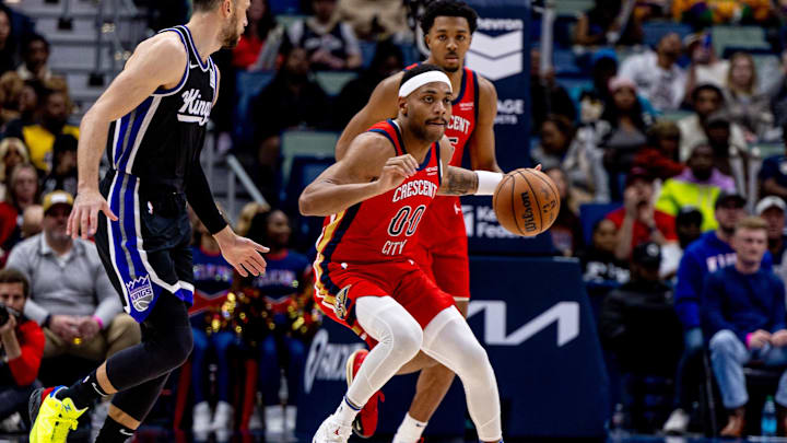 Feb 13, 2025; New Orleans, Louisiana, USA;  New Orleans Pelicans forward Bruce Brown (00) dribbles against the Sacramento Kings during the second half at Smoothie King Center. Mandatory Credit: Stephen Lew-Imagn Images