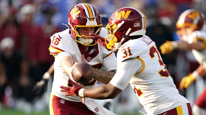 Aug 28, 2026; Baltimore, Maryland, USA;  Washington Commanders quarterback Athan Kaliakmanis (16) hands the ball to running back Kaytron Allen (31) during the first quarter against the Baltimore Ravens at M&T Bank Stadium.  Mandatory Credit: Mitch Stringer-Imagn Images
