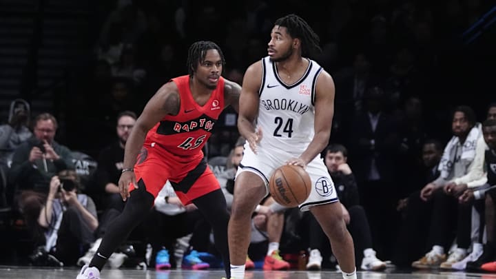 Oct 18, 2024; Brooklyn, New York, USA; Brooklyn Nets small guard Cam Thomas (24) dribbles the ball against Toronto Raptors forward Bruno Fernando (24) during the second half at Barclays Center. Mandatory Credit: Gregory Fisher-Imagn Images
