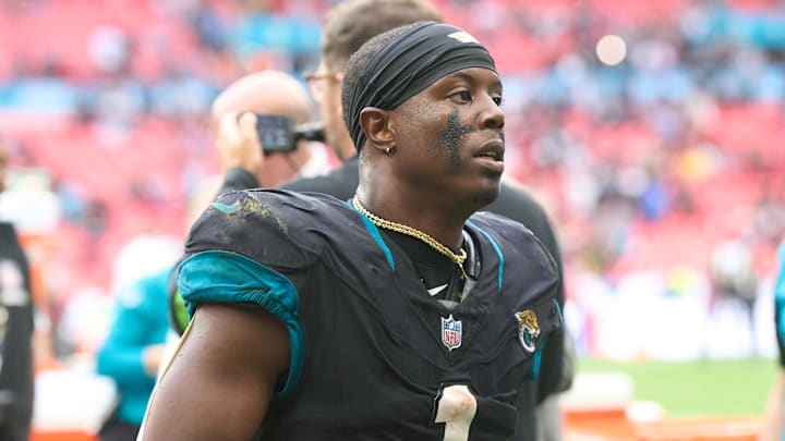 Oct 1, 2023; London, United Kingdom;  Jacksonville Jaguars running back Travis Etienne Jr. (1) leaves the field after the second half of an NFL International Series game at Wembley Stadium. Mandatory Credit: Peter van den Berg-Imagn Images
