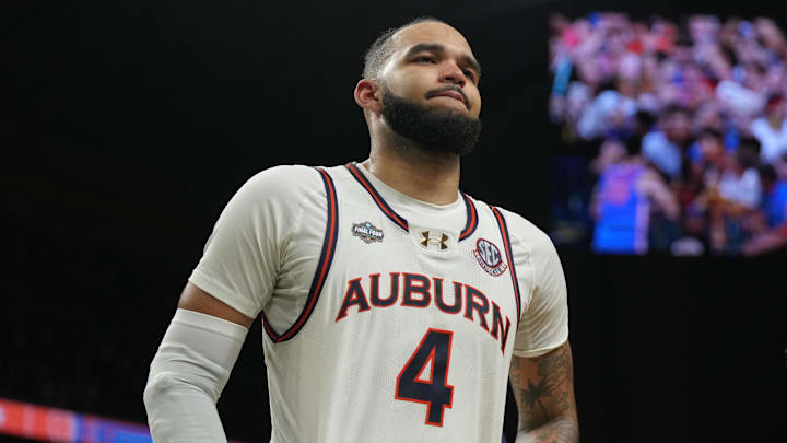 Apr 5, 2025; San Antonio, TX, USA;  Auburn Tigers forward Johni Broome (4) reacts after losing to the Florida Gators in the semifinals of the men's Final Four of the 2025 NCAA Tournament at the Alamodome. Mandatory Credit: Robert Deutsch-Imagn Images
