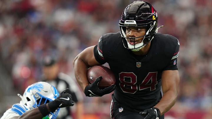 Arizona Cardinals tight end Elijah Higgins (84) runs past Detroit Lions cornerback Terrion Arnold (0) at State Farm Stadium in Glendale, Ariz., on Sep 22, 2024.