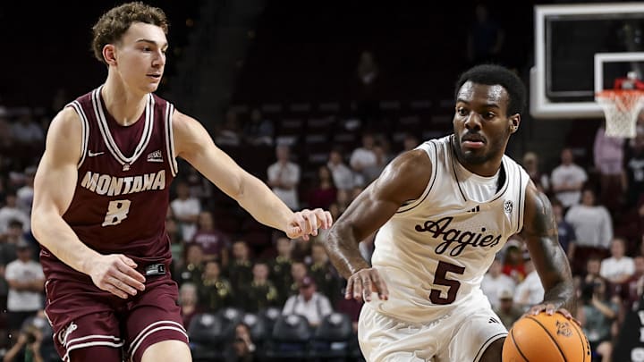 Nov 18, 2025; College Station, Texas, USA; Texas A&M Aggies guard Jacari Lane (5) drives to the basket as Montana Grizzlies guard Tyler Isaak (8) defends during the first half at Reed Arena. Mandatory Credit: Maria Lysaker-Imagn Images Nov 18, 2025; College Station, Texas, USA; Texas A&M Aggies guard Jacari Lane (5) drives to the basket as Montana Grizzlies guard Tyler Isaak (8) defends during the first half at Reed Arena. Mandatory Credit: Maria Lysaker-Imagn Images