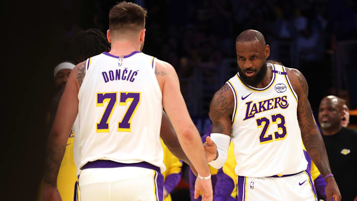 Mar 2, 2025; Los Angeles, California, USA; Los Angeles Lakers forward LeBron James (23) and guard Luka Doncic (77) react after a play during the first quarter against the LA Clippers at Crypto.com Arena. Mandatory Credit: Jason Parkhurst-Imagn Images