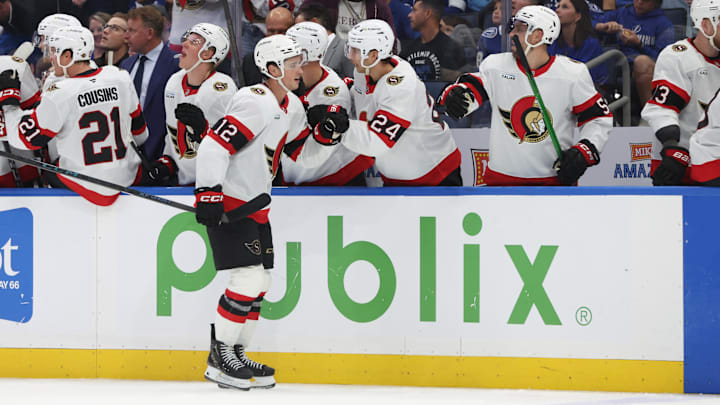 Oct 9, 2025; Tampa, Florida, USA; Ottawa Senators center Shane Pinto (12) is congratulated after he scored a goal against the Tampa Bay Lightning during the third period at Benchmark International Arena. Mandatory Credit: Kim Klement Neitzel-Imagn Images