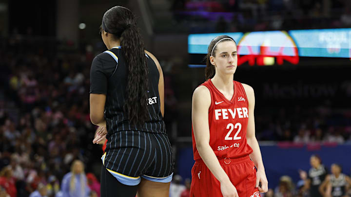 Aug 30, 2024; Chicago, Illinois, USA; Indiana Fever guard Caitlin Clark (22) walks by Chicago Sky forward Angel Reese (5) during the second half at Wintrust Arena. Mandatory Credit: Kamil Krzaczynski-Imagn Images