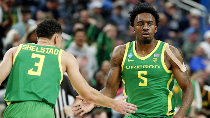 Mar 21, 2024; Pittsburgh, PA, USA; Oregon Ducks guard Jermaine Couisnard (5) celebrates with guard