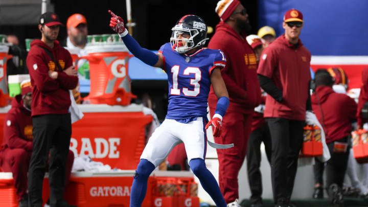 Oct 22, 2023; East Rutherford, New Jersey, USA; New York Giants wide receiver Jalin Hyatt (13) reacts after a first down catch during the first half against the Washington Commanders at MetLife Stadium.  