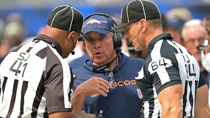 Sep 21, 2025; Inglewood, California, USA;  Denver Broncos head coach Sean Payton talks with with side judge Boris Cheek (41) and line judge Mark Steinkerchner (84) in the first half against the Los Angeles Chargers at SoFi Stadium. 