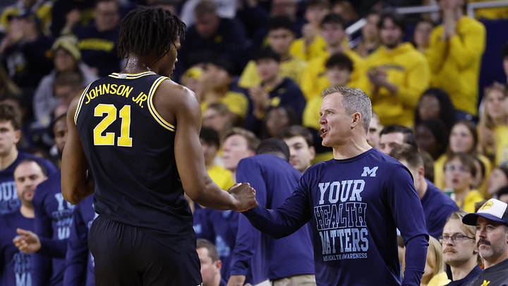 Jan 27, 2026; Ann Arbor, Michigan, USA; Michigan Wolverines head coach Dusty May talks to forward Morez Johnson Jr. (21) in the first half at Crisler Center. Mandatory Credit: Rick Osentoski-Imagn Images Jan 27, 2026; Ann Arbor, Michigan, USA; Michigan Wolverines head coach Dusty May talks to forward Morez Johnson Jr. (21) in the first half at Crisler Center. Mandatory Credit: Rick Osentoski-Imagn Images
