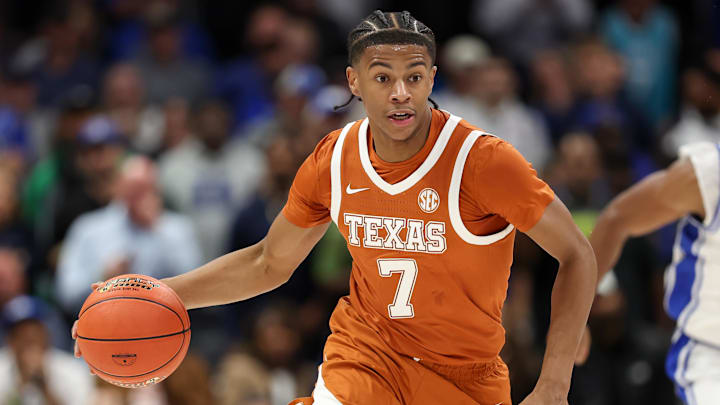 Nov 4, 2025; Charlotte, North Carolina, USA; Texas Longhorns guard Simeon Wilcher (7) brings the ball down court against the Duke Blue Devils during the second half of the Dick Vitale’s Invitational game at Spectrum Center. Mandatory Credit: Cory Knowlton-Imagn Images