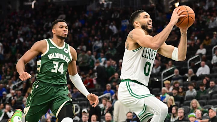 Nov 10, 2024; Milwaukee, Wisconsin, USA; Boston Celtics forward Jayson Tatum (0) takes a shot against Milwaukee Bucks forward Giannis Antetokounmpo (34) in the third quarter at Fiserv Forum. Mandatory Credit: Benny Sieu-Imagn Images Nov 10, 2024; Milwaukee, Wisconsin, USA; Boston Celtics forward Jayson Tatum (0) takes a shot against Milwaukee Bucks forward Giannis Antetokounmpo (34) in the third quarter at Fiserv Forum. Mandatory Credit: Benny Sieu-Imagn Images