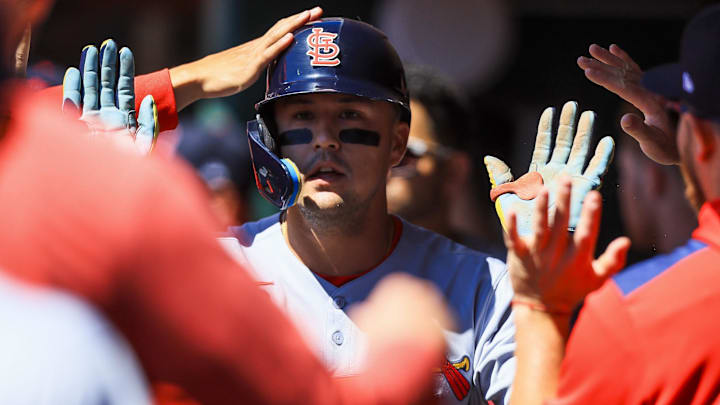 Aug 31, 2025; Cincinnati, Ohio, USA; St. Louis Cardinals outfielder Lars Nootbaar (21) high fives teammates after scoring on a sacrifice fly out hit by third baseman Nolan Gorman (not pictured) in the first inning against the Cincinnati Reds at Great American Ball Park. Mandatory Credit: Katie Stratman-Imagn Images
