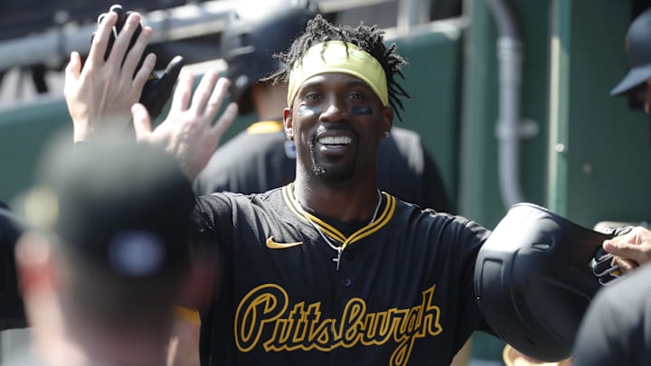 Pittsburgh Pirates designated hitter Andrew McCutchen (22) celebrates in the dugout after hitting a solo home run against the Washington Nationals during the third inning at PNC Park. 