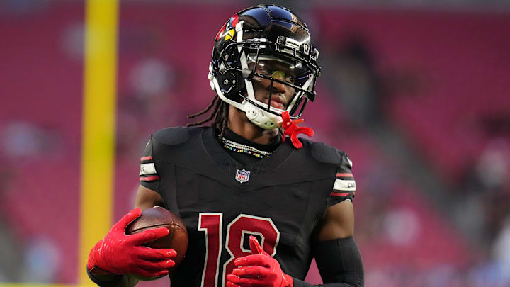 Arizona Cardinals receiver Marvin Harrison Jr. (18) warms up before their game against the Los Angeles Chargers at State Farm Stadium in Glendale on Oct. 21, 2024. Arizona Cardinals receiver Marvin Harrison Jr. (18) warms up before their game against the Los Angeles Chargers at State Farm Stadium in Glendale on Oct. 21, 2024.
