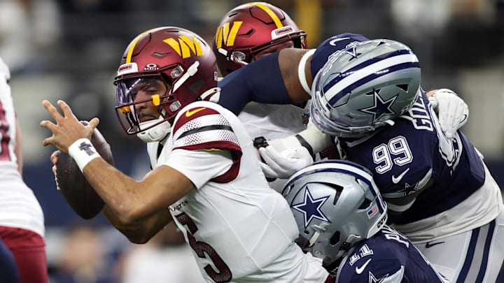 Washington Commanders quarterback Jayden Daniels is sacked by Dallas Cowboys linebacker Micah Parsons during the first quarter at AT&T Stadium. 