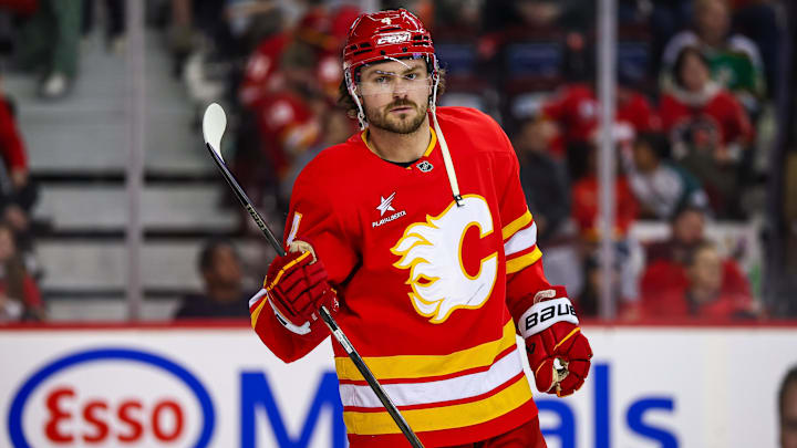 Apr 11, 2025; Calgary, Alberta, CAN; Calgary Flames defenseman Rasmus Andersson (4) against the Minnesota Wild during the third period at Scotiabank Saddledome. Mandatory Credit: Sergei Belski-Imagn Images