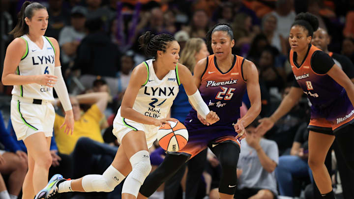 Jul 9, 2025; Phoenix, Arizona, USA; Minnesota Lynx forward Napheesa Collier (24) against Phoenix Mercury forward Alyssa Thomas (25) during the first half at PHX Arena. Mandatory Credit: Mark J. Rebilas-Imagn Images
