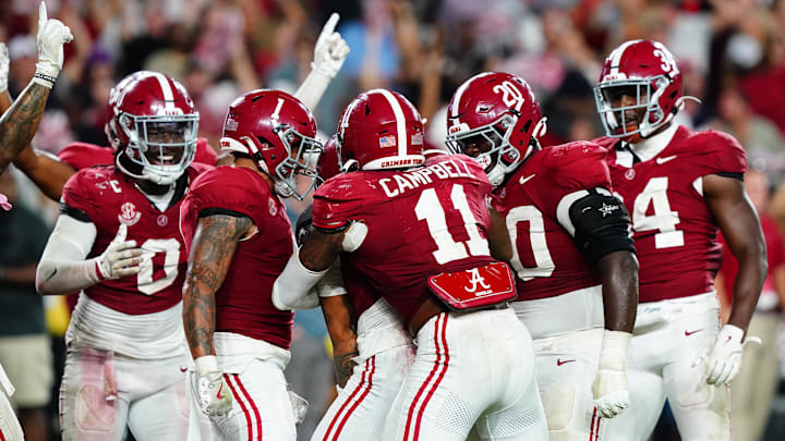 Members of the Alabama Crimson Tide defensive celebrate after a pass interception by defensive back Zabien Brown (2) to seal a victory over the Georgia Bulldogs during the fourth quarter at Bryant-Denny Stadium. Members of the Alabama Crimson Tide defensive celebrate after a pass interception by defensive back Zabien Brown (2) to seal a victory over the Georgia Bulldogs during the fourth quarter at Bryant-Denny Stadium.
