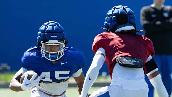 University of Kentucky wide receiver Darius Cannon makes his way around a defender during spring football practice on Saturday, April 6, 2024.