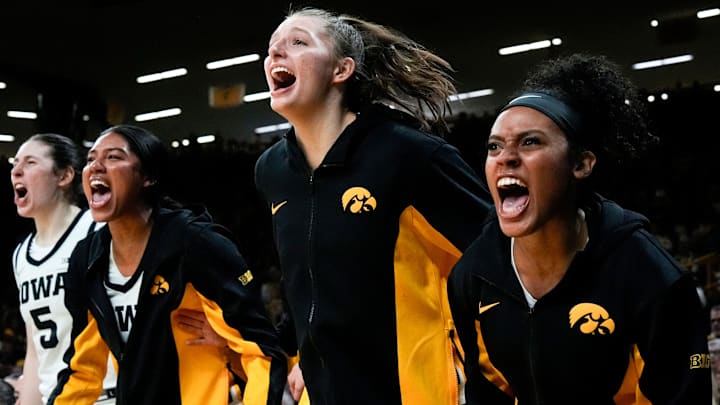Iowa center Ava Heiden (5), Iowa forward Jada Gyamfi (23), Iowa guard Teagan Mallegni (55), and Iowa guard Kennise Johnson (13) react during a game against the Drake Bulldogs Nov. 13, 2025 at Carver-Hawkeye Arena in Iowa City, Iowa. Iowa center Ava Heiden (5), Iowa forward Jada Gyamfi (23), Iowa guard Teagan Mallegni (55), and Iowa guard Kennise Johnson (13) react during a game against the Drake Bulldogs Nov. 13, 2025 at Carver-Hawkeye Arena in Iowa City, Iowa.