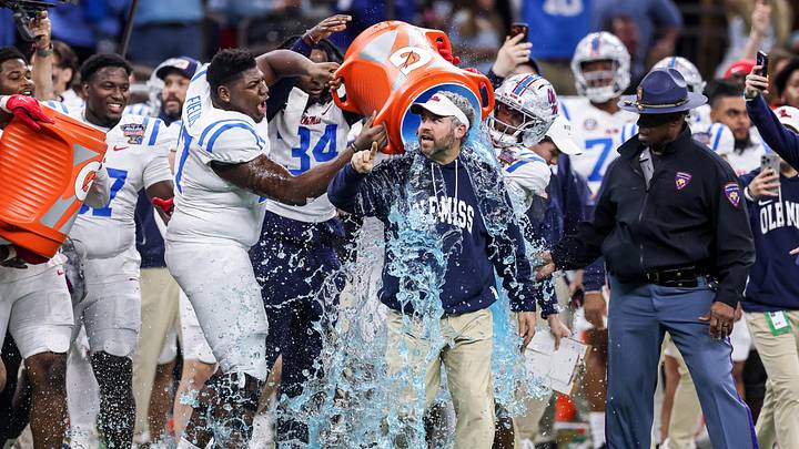 Jan 1, 2026; New Orleans, LA, USA; Mississippi Rebels players pour Gatorade on head coach Pete Golding near the end of the fourth quarter during the 2026 Sugar Bowl and quarterfinal game of the College Football Playoff against the Georgia Bulldogs at Caesars Superdome. Mandatory Credit: Stephen Lew-Imagn Images Jan 1, 2026; New Orleans, LA, USA; Mississippi Rebels players pour Gatorade on head coach Pete Golding near the end of the fourth quarter during the 2026 Sugar Bowl and quarterfinal game of the College Football Playoff against the Georgia Bulldogs at Caesars Superdome. Mandatory Credit: Stephen Lew-Imagn Images