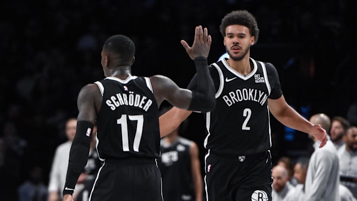 Dec 8, 2024; Brooklyn, New York, USA; Brooklyn Nets forward Cameron Johnson (2) and Brooklyn Nets guard Dennis Schroder (17) react during the second half against the Milwaukee Bucks at Barclays Center. Mandatory Credit: John Jones-Imagn Images