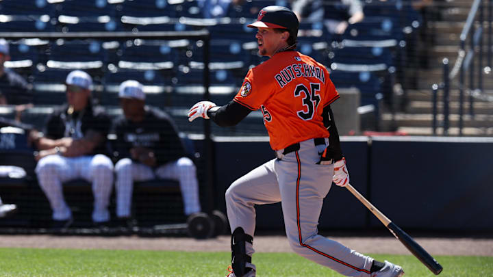 Mar 11, 2025; Tampa, Florida, USA; Baltimore Orioles catcher Adley Rutschman (35) singles against the New York Yankees in the first inning during spring training at George M. Steinbrenner Field. 
