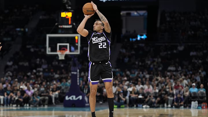 Apr 4, 2025; Charlotte, North Carolina, USA; Sacramento Kings guard Devin Carter (22) with a jump shot against the Charlotte Hornets during the second quarter at Spectrum Center. Mandatory Credit: Jim Dedmon-Imagn Images