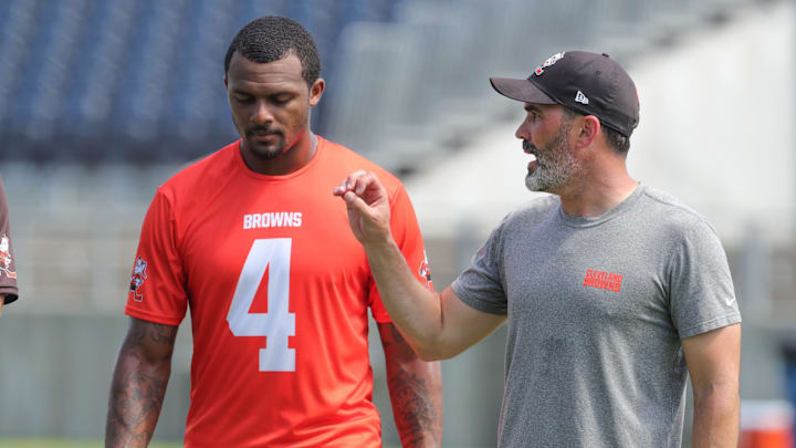 Quarterback Deshaun Watson, talking with coach Kevin Stefanski at a 2022 minicamp session, has only played in 19 of the Browns' 52 games since being acquired from the Texans in 2022.