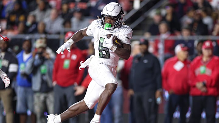 Oct 18, 2025; Piscataway, New Jersey, USA;  Oregon Ducks running back Noah Whittington (6) scores a rushing touchdown during the first half against the Rutgers Scarlet Knights at SHI Stadium. Mandatory Credit: Vincent Carchietta-Imagn Images
