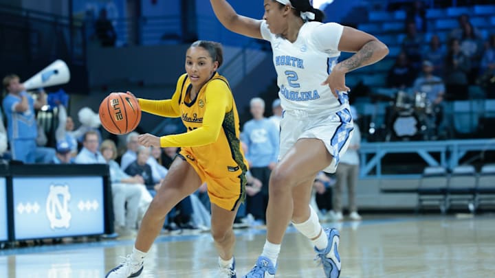 Cal's Lulu Twidale drives on Carolina defender Cal's Lulu Twidale drives on Carolina defender