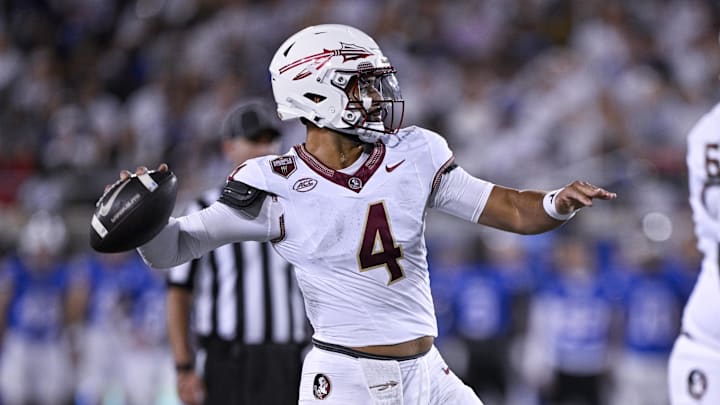 Sep 28, 2024; Dallas, Texas, USA; Florida State Seminoles quarterback DJ Uiagalelei (4) passes against the Southern Methodist Mustangs during the second quarter at Gerald J. Ford Stadium. Mandatory Credit: Jerome Miron-Imagn Images